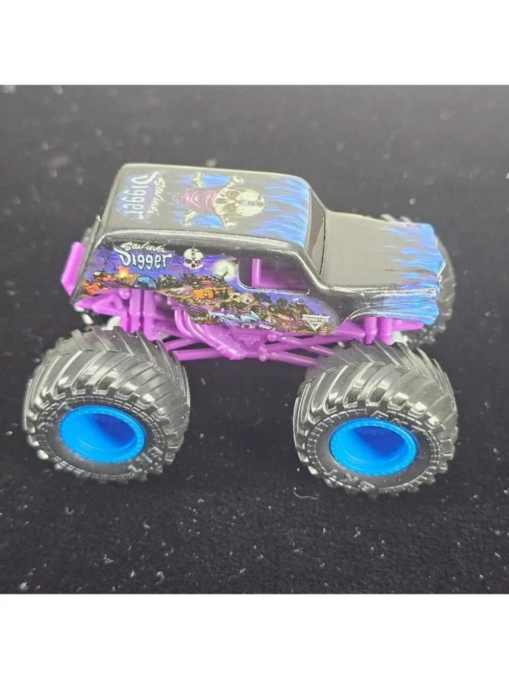 Grave Digger Monster Truck Toy Purple & Black 2024 Copyright Skeleton Design 4-W